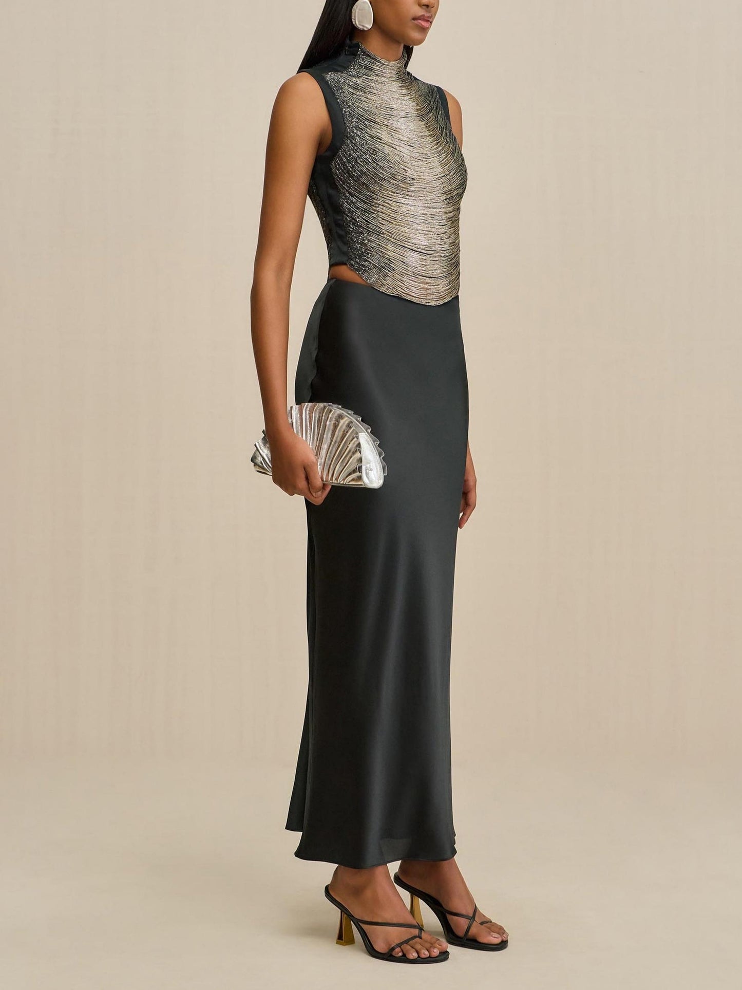 Elegant Black Ensemble: Sleeveless Fringe Top Paired with Flowing Satin Skirt