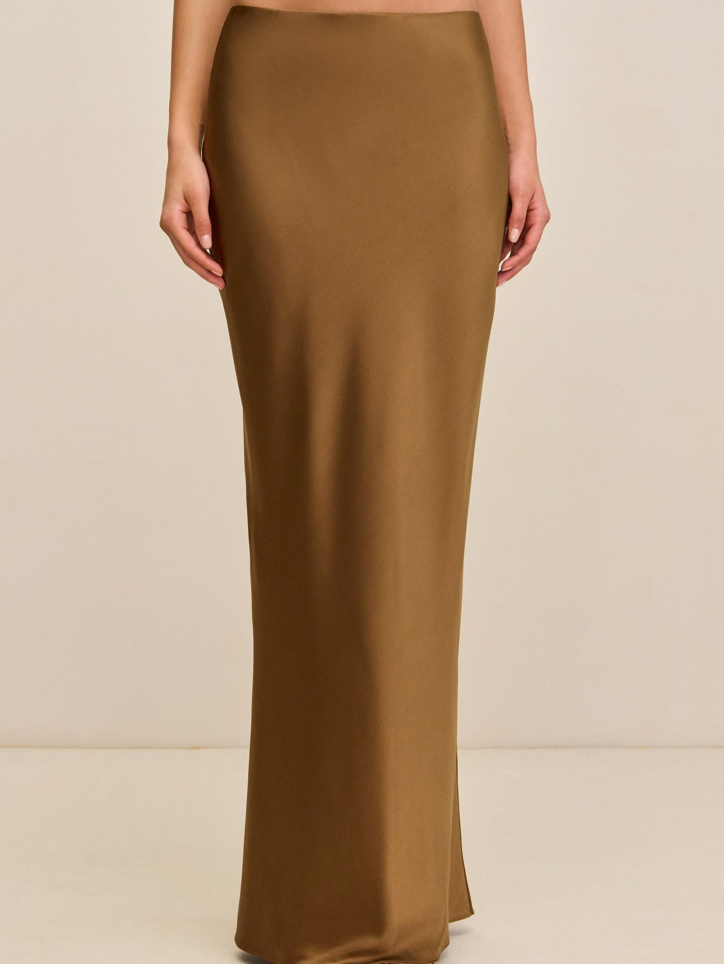 Elegant Bronze Ensemble: Sleeveless Fringe Top Paired with Flowing Satin Skirt