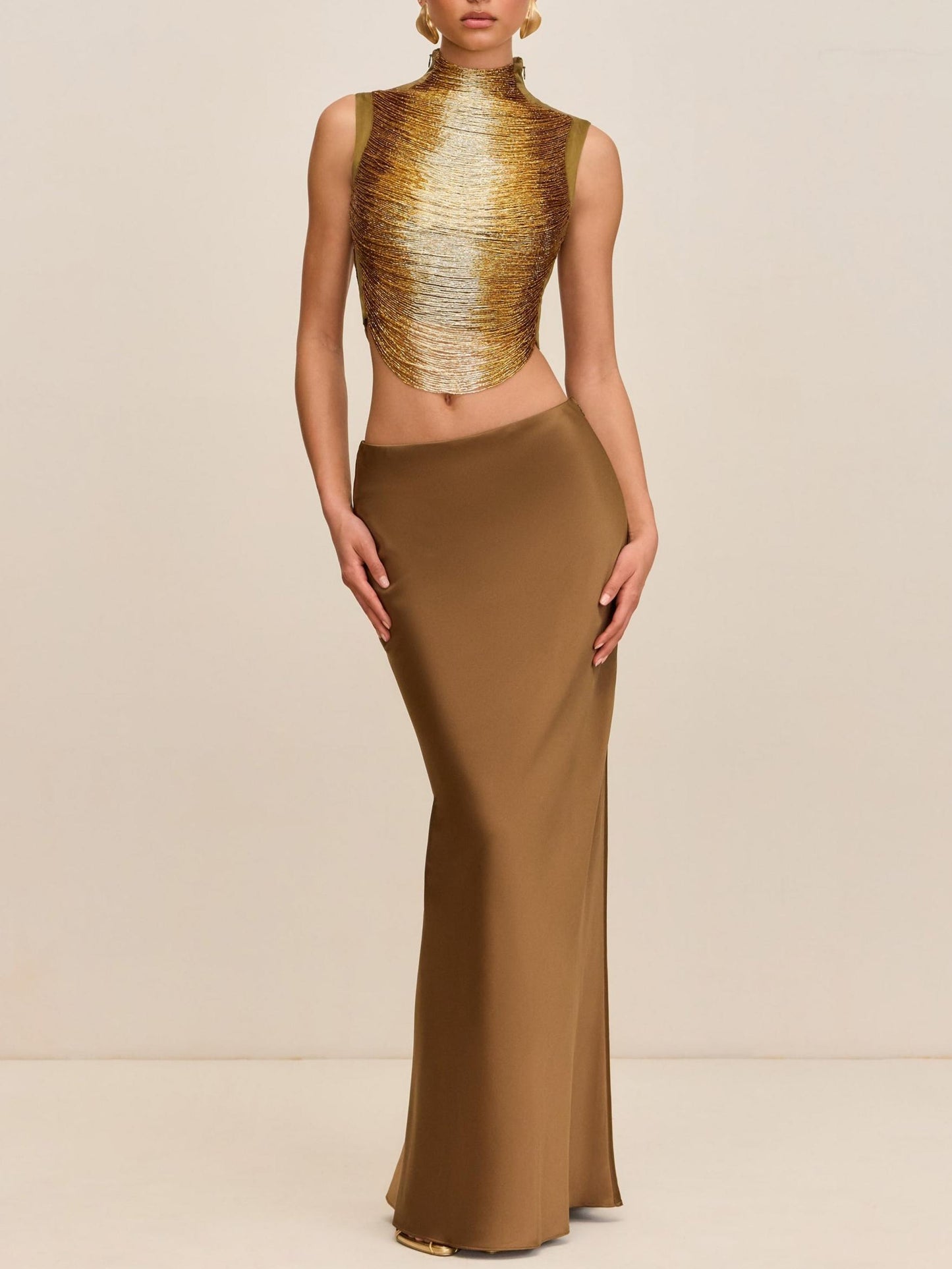 Elegant Bronze Ensemble: Sleeveless Fringe Top Paired with Flowing Satin Skirt