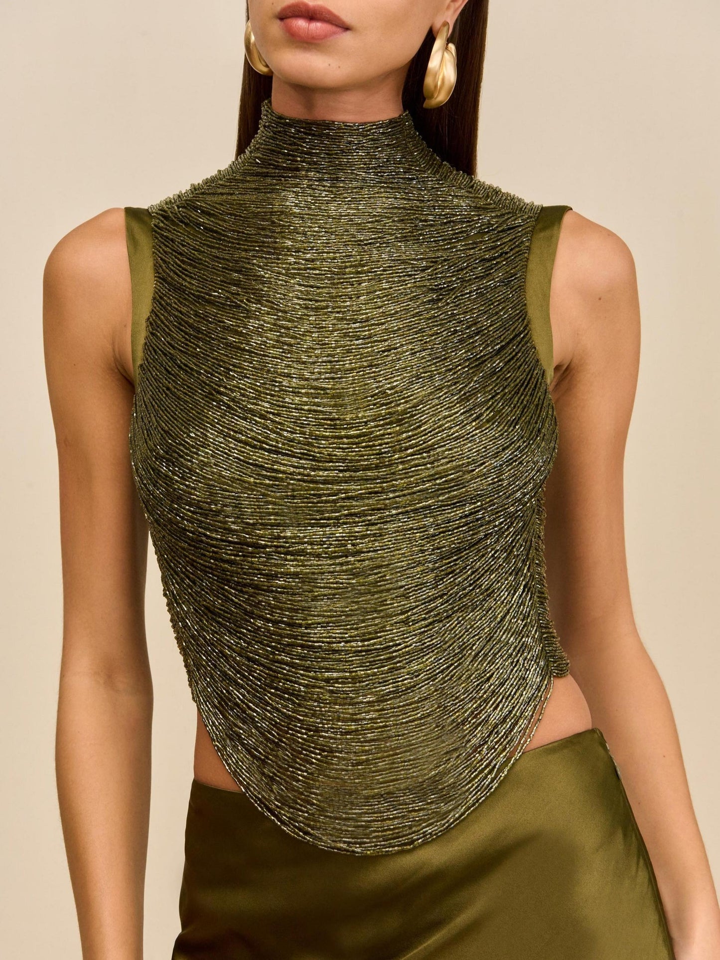 Elegant Rosemary Ensemble: Sleeveless Fringe Top Paired with Flowing Satin Skirt