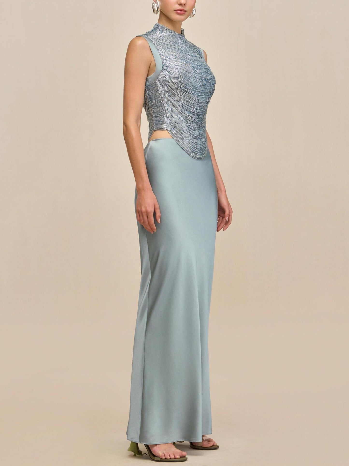 Elegant Celadon Ensemble: Sleeveless Fringe Top Paired with Flowing Satin Skirt